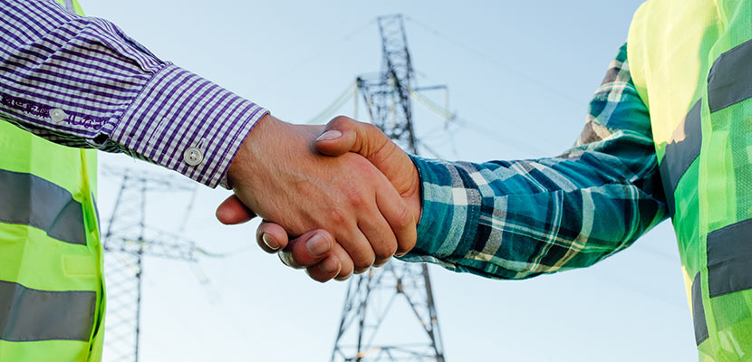 Engineers Shaking Hands Against High Voltage Tower 2024 10 18 09 04 06 Utc1 Partnership image - CJS Power & Technology